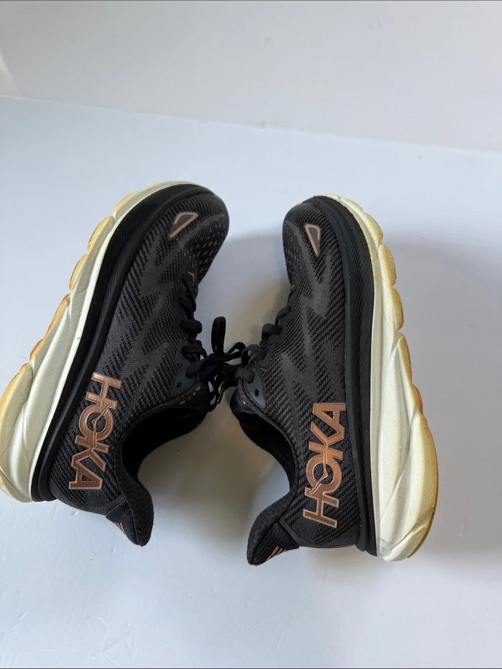Hoka Women's Black Athletic Shoes with Rose Gold Logo